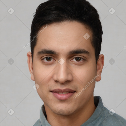 Joyful white young-adult male with short  black hair and brown eyes