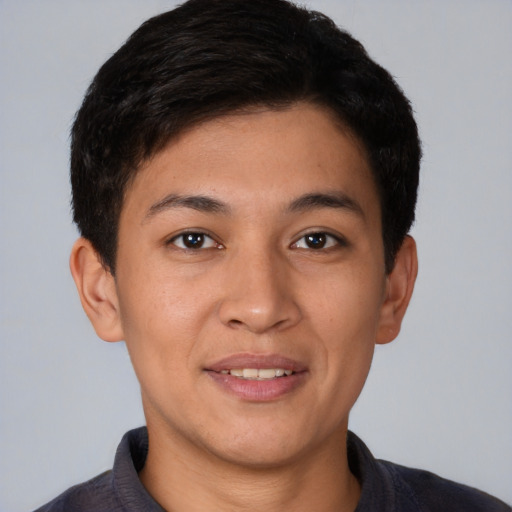 Joyful white young-adult male with short  black hair and brown eyes
