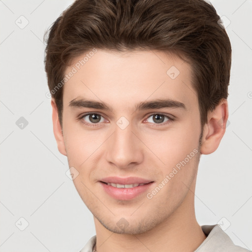 Joyful white young-adult male with short  brown hair and brown eyes