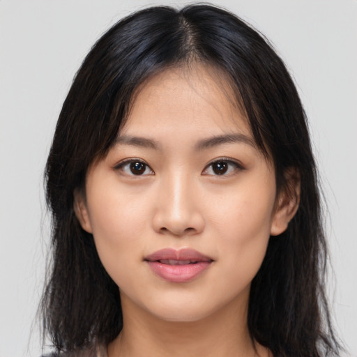 Neutral asian young-adult female with medium  brown hair and brown eyes