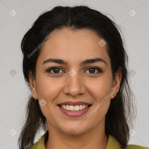 Joyful latino young-adult female with medium  brown hair and brown eyes