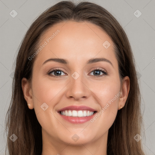 Joyful white young-adult female with long  brown hair and grey eyes