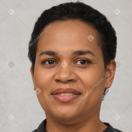 Joyful latino young-adult female with short  brown hair and brown eyes