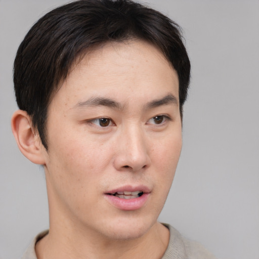 Neutral asian young-adult male with short  brown hair and brown eyes