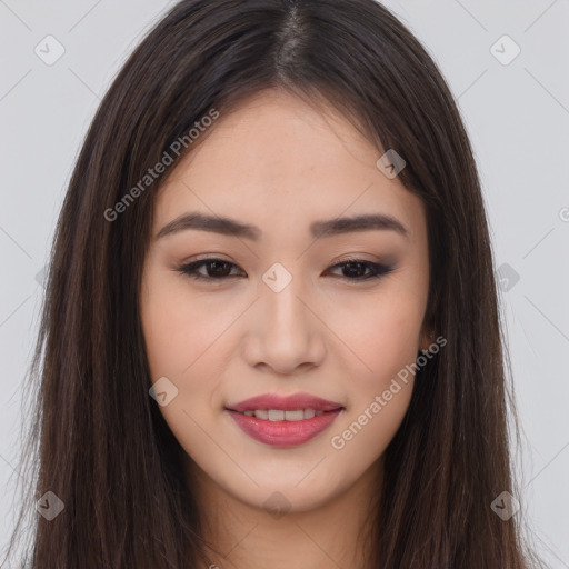 Joyful asian young-adult female with long  brown hair and brown eyes