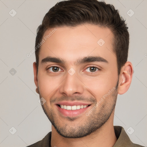 Joyful white young-adult male with short  brown hair and brown eyes