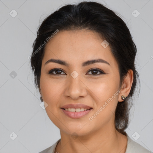 Joyful latino young-adult female with medium  brown hair and brown eyes