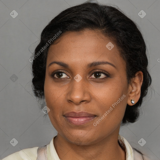 Joyful black young-adult female with medium  brown hair and brown eyes