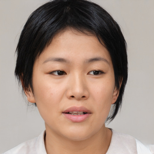 Neutral asian young-adult female with medium  black hair and brown eyes