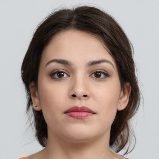 Neutral white young-adult female with medium  brown hair and brown eyes