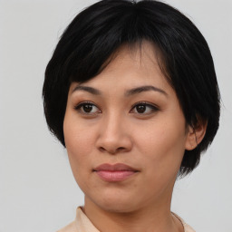 Joyful asian young-adult female with medium  black hair and brown eyes