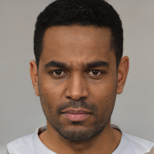 Neutral latino young-adult male with short  black hair and brown eyes