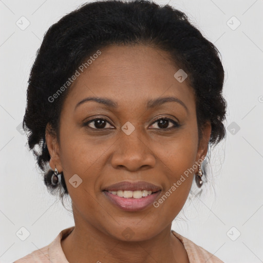 Joyful black adult female with medium  brown hair and brown eyes