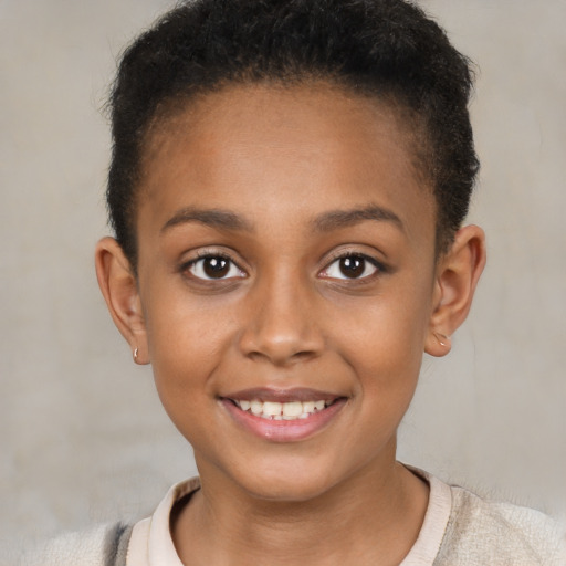 Joyful black child female with short  brown hair and brown eyes