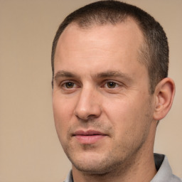 Joyful white adult male with short  brown hair and brown eyes