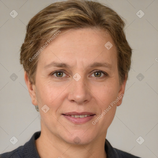 Joyful white adult female with short  brown hair and grey eyes