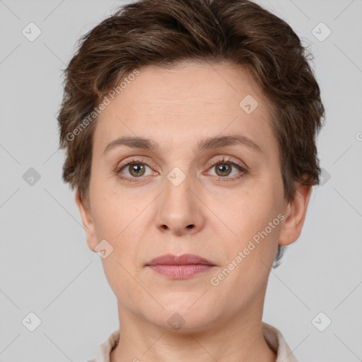 Joyful white adult female with short  brown hair and brown eyes