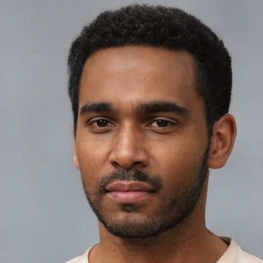 Neutral black young-adult male with short  black hair and brown eyes