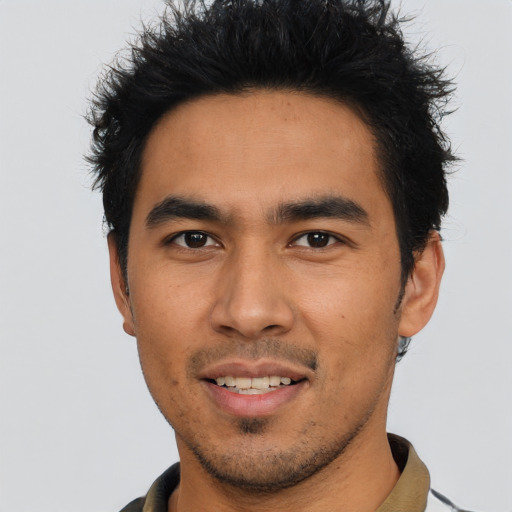 Joyful asian young-adult male with short  brown hair and brown eyes
