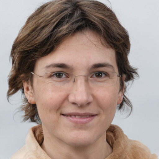 Joyful white adult female with medium  brown hair and grey eyes