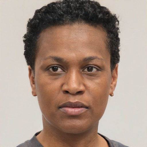 Neutral black adult female with short  black hair and brown eyes