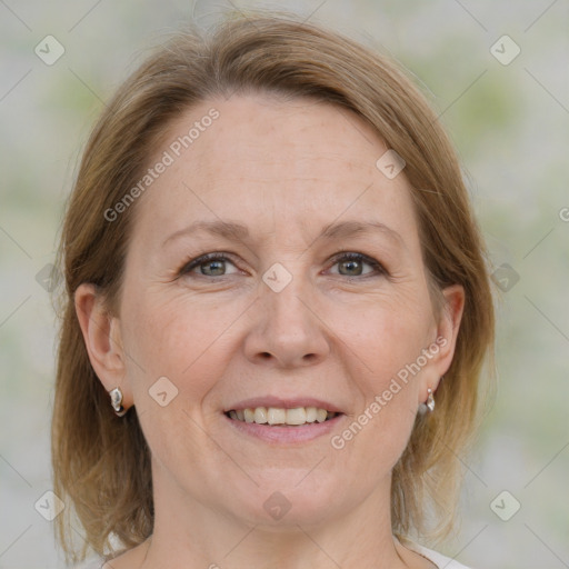 Joyful white adult female with medium  brown hair and grey eyes