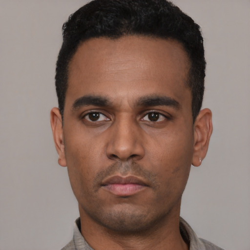Neutral latino young-adult male with short  black hair and brown eyes
