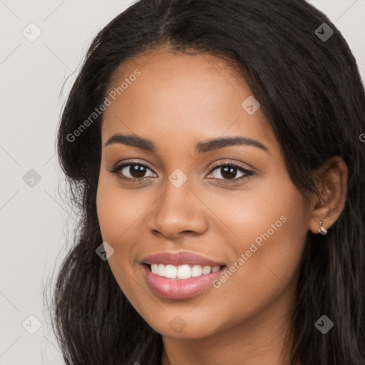 Joyful latino young-adult female with long  brown hair and brown eyes