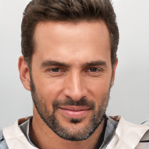 Joyful white adult male with short  brown hair and brown eyes