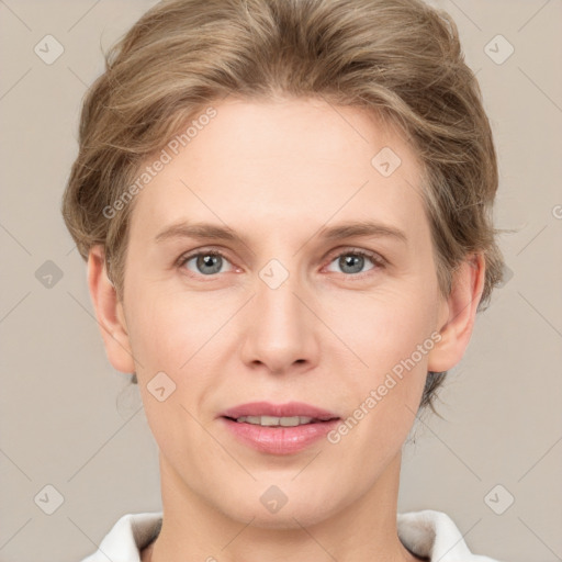 Joyful white young-adult female with short  brown hair and grey eyes