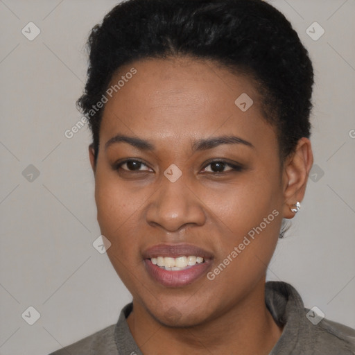 Joyful black young-adult female with short  black hair and brown eyes