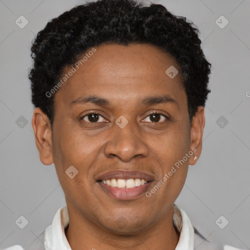 Joyful latino young-adult male with short  brown hair and brown eyes