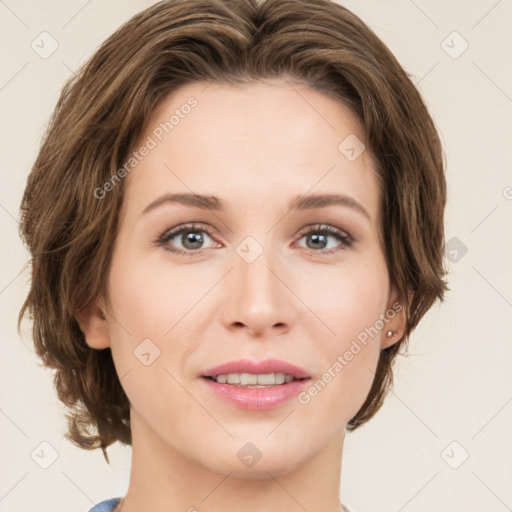 Joyful white young-adult female with medium  brown hair and green eyes