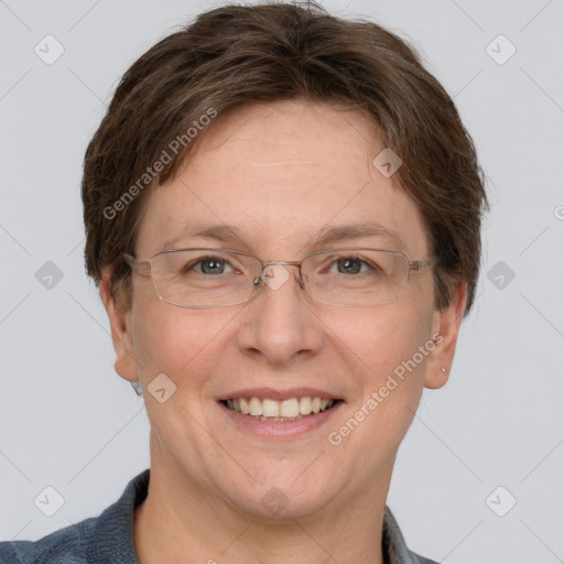 Joyful white adult female with short  brown hair and grey eyes