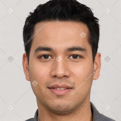 Joyful white young-adult male with short  black hair and brown eyes