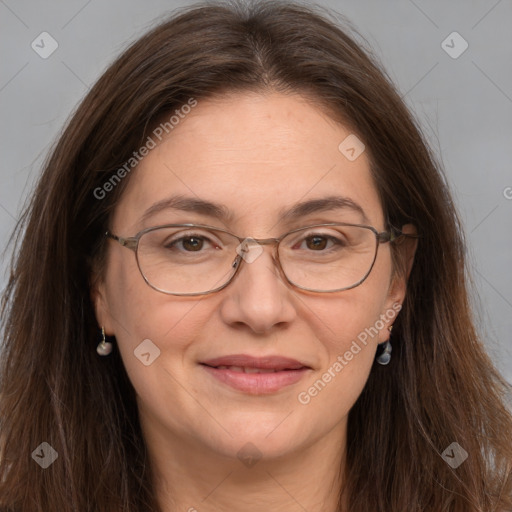 Joyful white adult female with long  brown hair and grey eyes