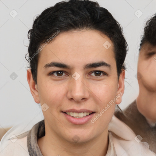 Joyful latino young-adult male with short  brown hair and brown eyes