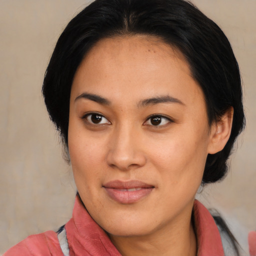 Joyful asian young-adult female with medium  black hair and brown eyes