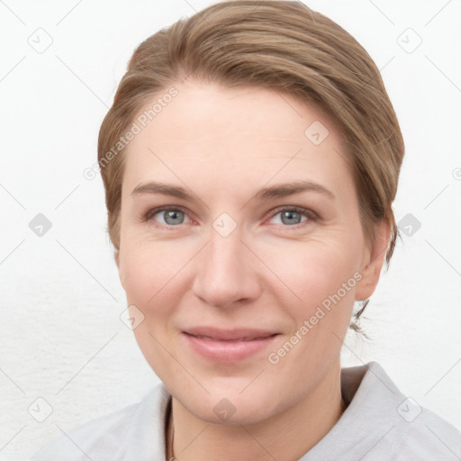 Joyful white young-adult female with medium  brown hair and blue eyes