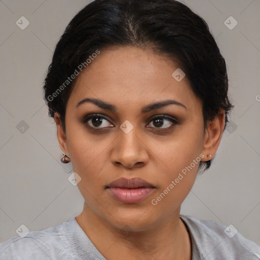 Joyful latino young-adult female with short  black hair and brown eyes