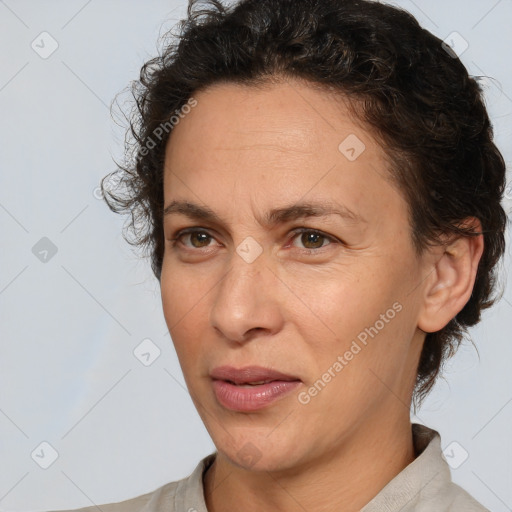 Joyful white adult female with short  brown hair and brown eyes