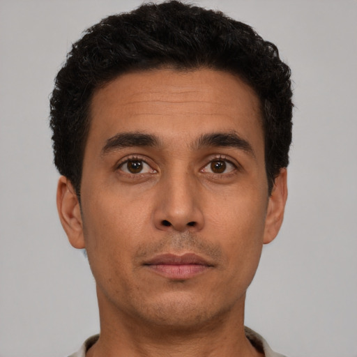 Neutral latino young-adult male with short  brown hair and brown eyes