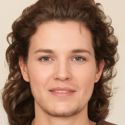 Joyful white young-adult male with medium  brown hair and brown eyes