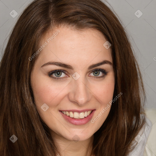 Joyful white young-adult female with long  brown hair and green eyes