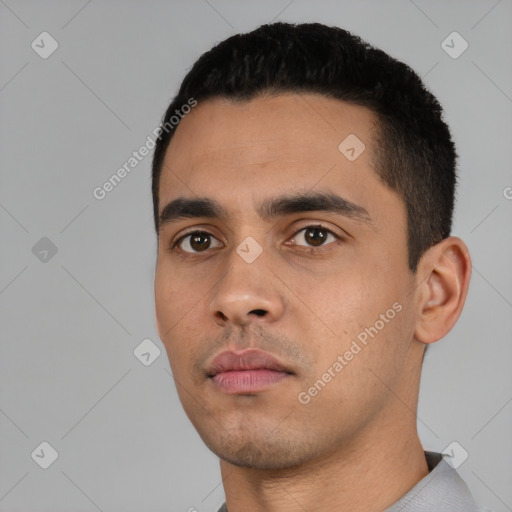 Neutral latino young-adult male with short  black hair and brown eyes