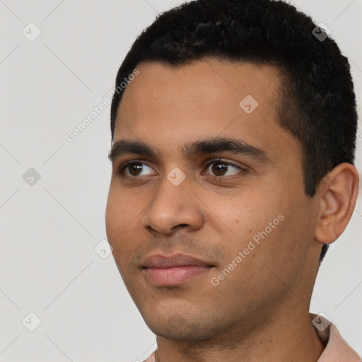 Neutral latino young-adult male with short  black hair and brown eyes