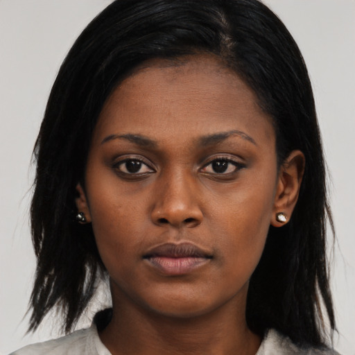 Neutral black young-adult female with long  black hair and brown eyes