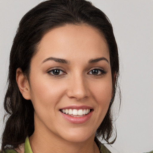 Joyful white young-adult female with medium  brown hair and brown eyes