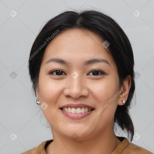 Joyful asian young-adult female with medium  brown hair and brown eyes