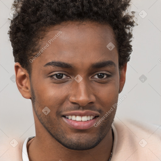 Joyful black young-adult male with short  brown hair and brown eyes